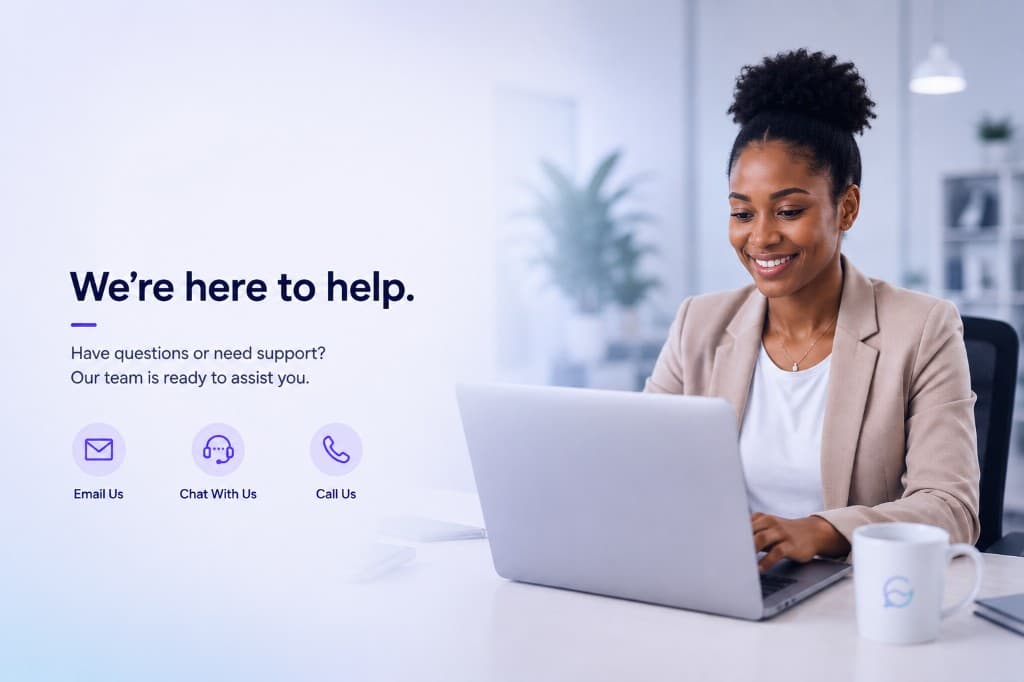Smiling support professional at a laptop in a bright modern office, contact hero artwork